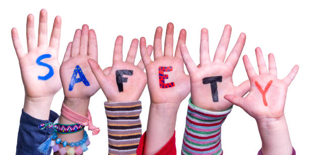 Children's hands spelling SAFETY